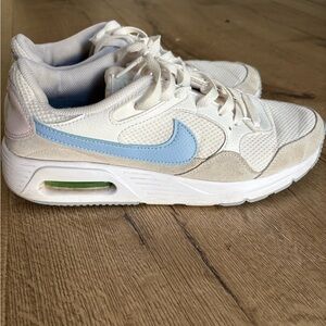 Nike White Sneakers with Light Blue Swoosh and Cream Accents